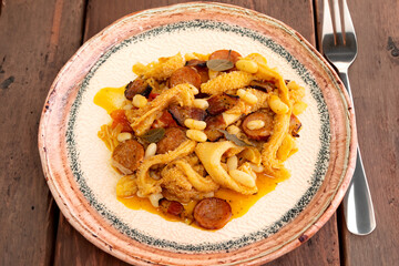 Beef tripe (bucho), beef stomach, tripe on a white plate. Dobradinha