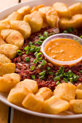 Delicious Platter of Yuca Fries with Shredded Beef and Spicy Sauce
