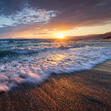 late sunset over wavy sea on acharavi beach corfu