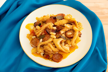 Beef tripe (bucho), beef stomach, tripe on a white plate. Dobradinha