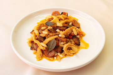 Beef tripe (bucho), beef stomach, tripe on a white plate. Dobradinha
