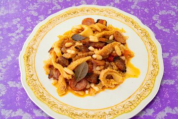 Beef tripe (bucho), beef stomach, tripe on a white plate. Dobradinha