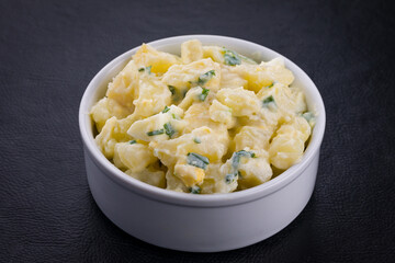 Delicious Homemade Potato Salad in White Ceramic Bowl