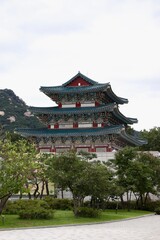Seoul, South Korea - September 11 2019: Gyeongbokgung Palace Pavilion with Lush Greenery on a Cloudy Day