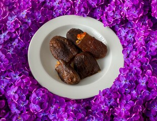 Dried stuffed eggplant. Close-up, selective focus. Traditional delicious Turkish foods; dried eggplant stuffed (Turkish name; Kuru patlican dolmasi). Rice, tomato, spices and olive oil known as dolma.