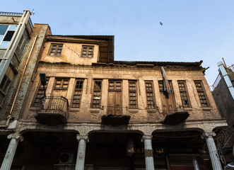 Exterior of a beautiful old facade of abandoned and ruined building in old city centre of Baghdad,...