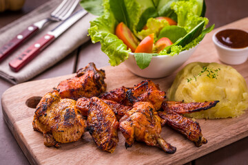 Grilled Chicken Wings with Mashed Potatoes and Fresh Salad