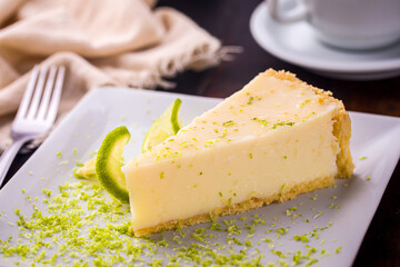 Delicious Slice of Lime Cheesecake on a White Plate