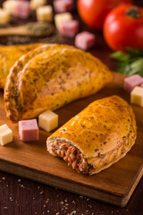 Close-Up of Delicious Empanadas on Wooden Board