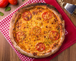 Delicious Tomato and Cheese Pizza on Checkered Cloth