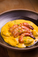 Gourmet Shrimp Dish with Creamy Sauce in Elegant Bowl