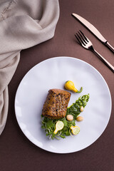 Gourmet Beef Dish with Garnish on Elegant Plate Setting