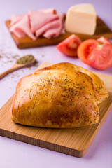 Golden Baked Bread with Fresh Ingredients on Cutting Board