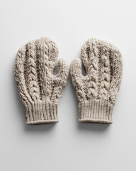 Beige knitted wool mittens on white background