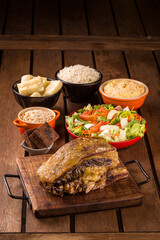 Traditional Brazilian Barbecue Feast with Assorted Side Dishes
