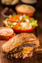 Delicious Baked Meat with Fresh Vegetable Side Dish and Sauce