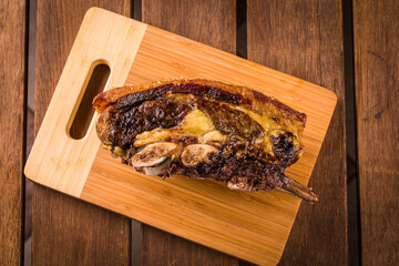 Delicious Grilled Rib on Wooden Cutting Board for Barbecue Lovers