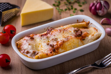 Delicious Homemade Lasagna in White Baking Dish on Wooden Table