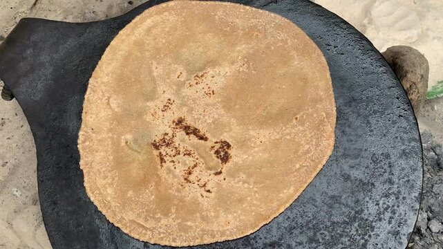 Wheat flour bread being made, dough preparation, homemade baking, traditional breadmaking, kneading dough, fresh bread loaf, artisan bakery, whole wheat ingredients, kitchen cooking process.