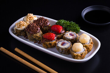 Gourmet Dessert Sushi Platter with Chocolate and Fruit Toppings