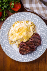 Delicious Grilled Mignon Steak With Creamy Fettuccine Alfredo And Cheese