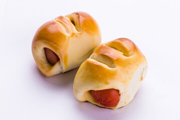 Two Freshly Baked Sausage Rolls on White Background