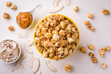 Delicious Caramel Popcorn in Bowl with Coconut and Butterscotch