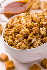 Delicious Caramel Popcorn in a White Ceramic Bowl for Snack Time