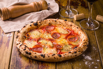 Delicious Pepperoni Pizza with Wine and Rustic Ambiance