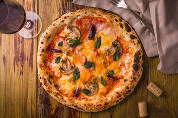 Delicious Pizza with Fresh Ingredients and a Glass of Wine