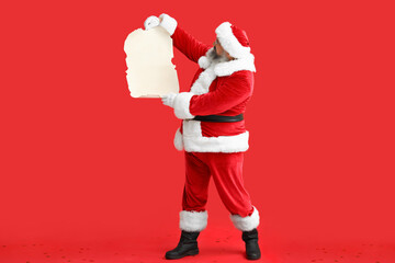 Santa Claus with blank letter on red background