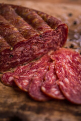 Sliced Salami on Rustic Wooden Surface for Gourmet Presentation