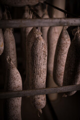 Traditional Salami Aging in Rustic Cellar Environment