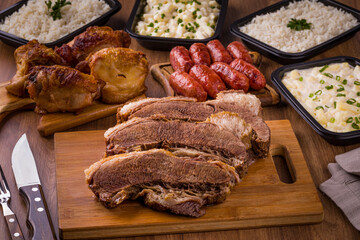 Delicious Barbecue Feast with Assorted Meats and Side Dishes