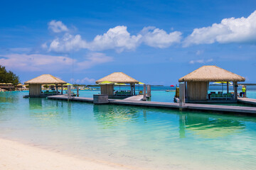 Cabanas at the shore in Caribbean islands during day time.