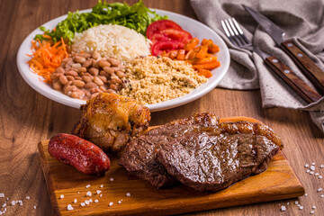 Delicious Brazilian Barbecue Feast with Rice and Fresh Vegetables
