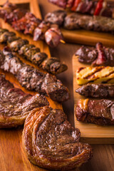 Close-Up of Grilled Meats on Wooden Platter at Barbecue Feast