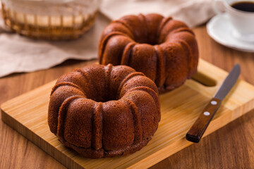 Delicious Chocolate Bundt Cakes on Wooden Cutting Board