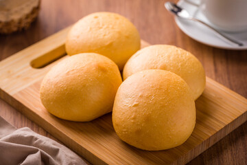 Freshly Baked Bread Rolls on Wooden Cutting Board