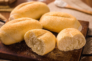 Freshly Baked Bread Rolls on Wooden Cutting Board