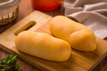 Freshly Baked Bread Rolls on Wooden Cutting Board