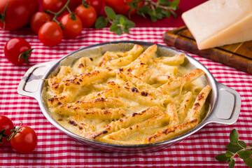 Delicious Baked Penne Pasta Dish With Cherry Tomatoes and Cheese