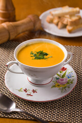 Elegant Soup Served in Floral Teacup with Breadside