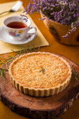 Delicious Savory Pie With Herbal Decoration on Wooden Board