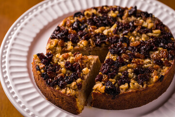 Delicious Homemade Fruit and Nut Cake on White Plate