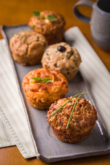 Delicious Assorted Savory Muffins on a Rustic Plate