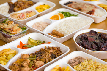 Assorted Takeout Meals in Eco-Friendly Containers on Table