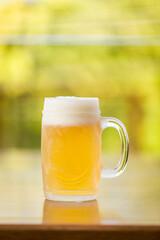 Refreshing Cold Beer Mug on Wooden Table Outdoors