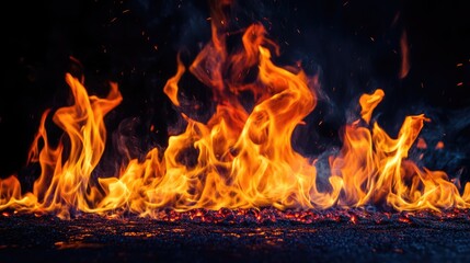 Fototapeta premium Wood burning in the fireplace. Fire with yellow and orange flame, fiery background