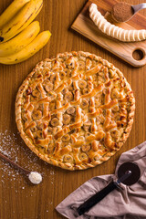Delicious Homemade Banana Pizza with Fresh Ingredients on Wooden Table